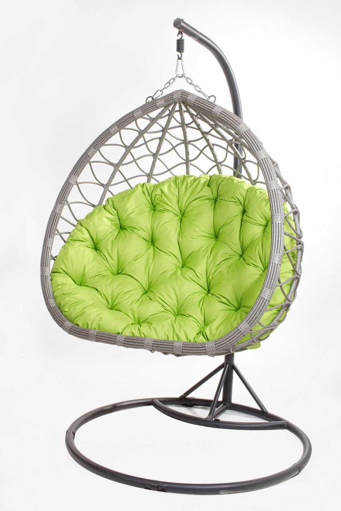 A hanging egg chair with a bright green cushion, shown against a white background.