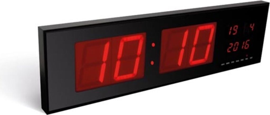 A digital LED wall clock displaying the time and date.