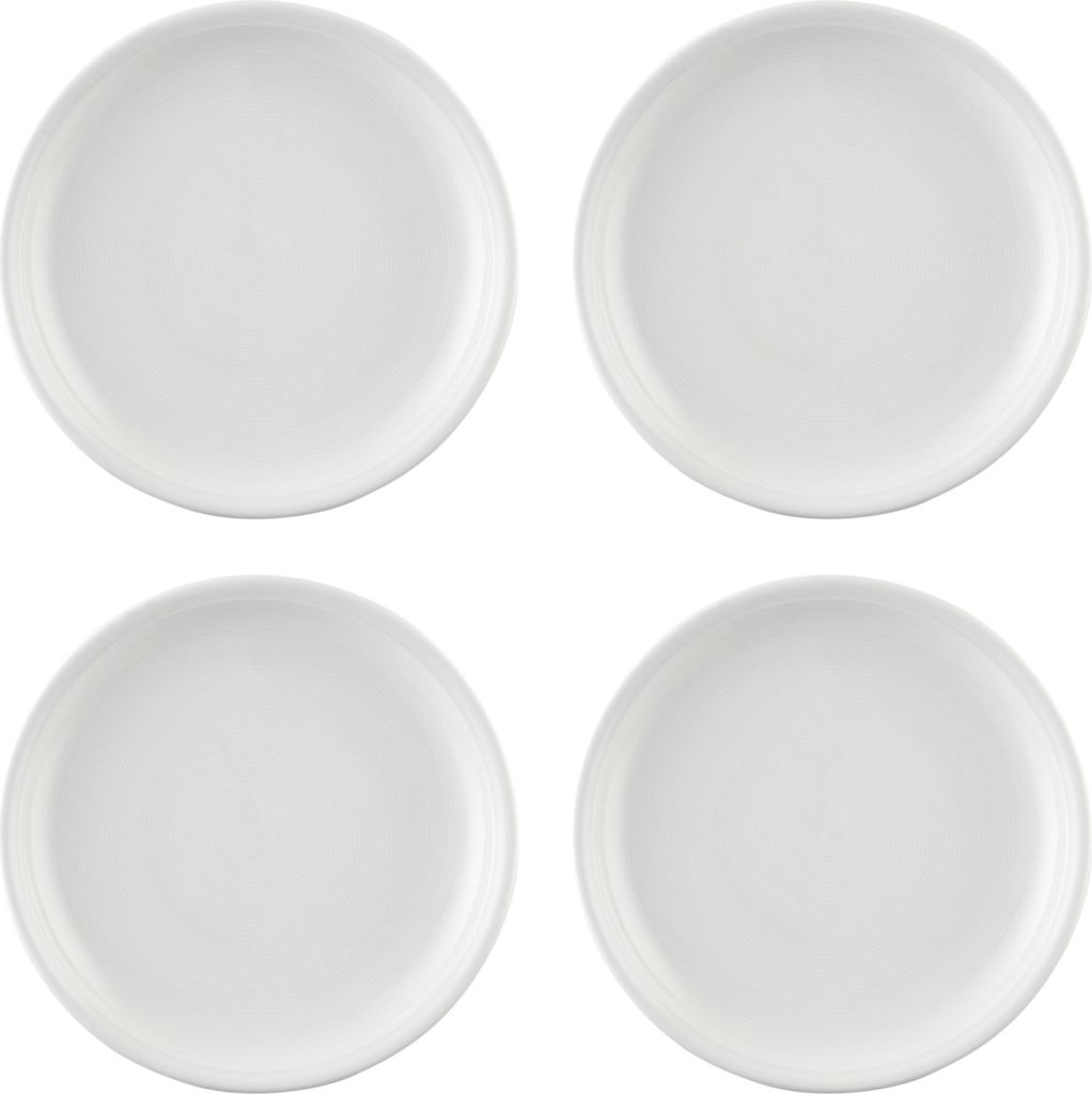 Four white plates arranged in a 2x2 grid on a white background.