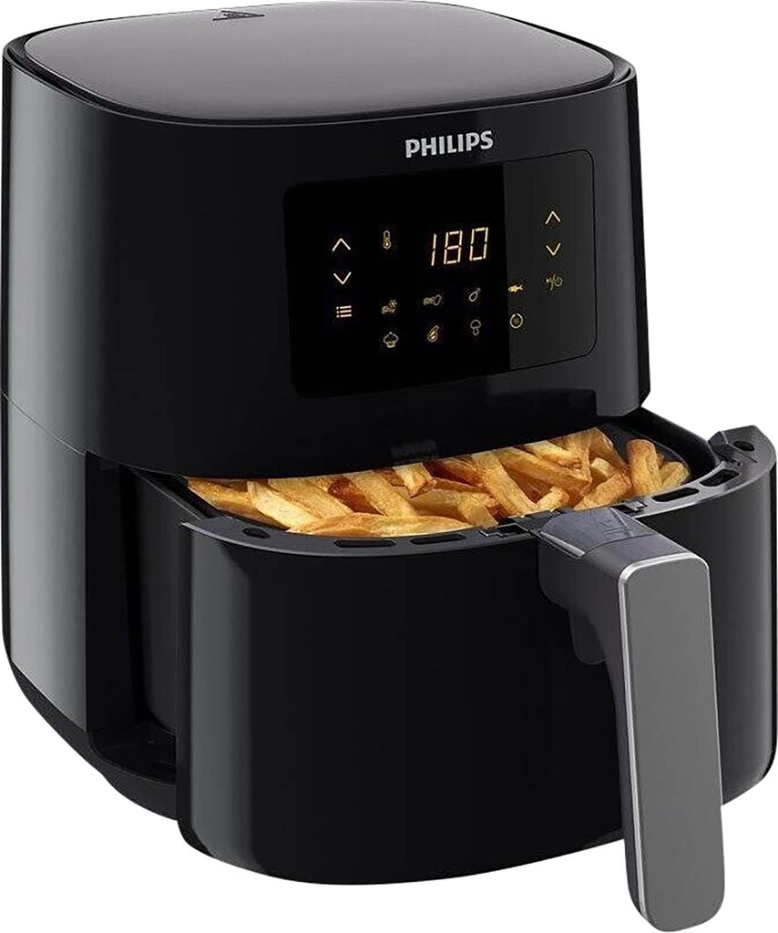 A black Philips air fryer filled with french fries.