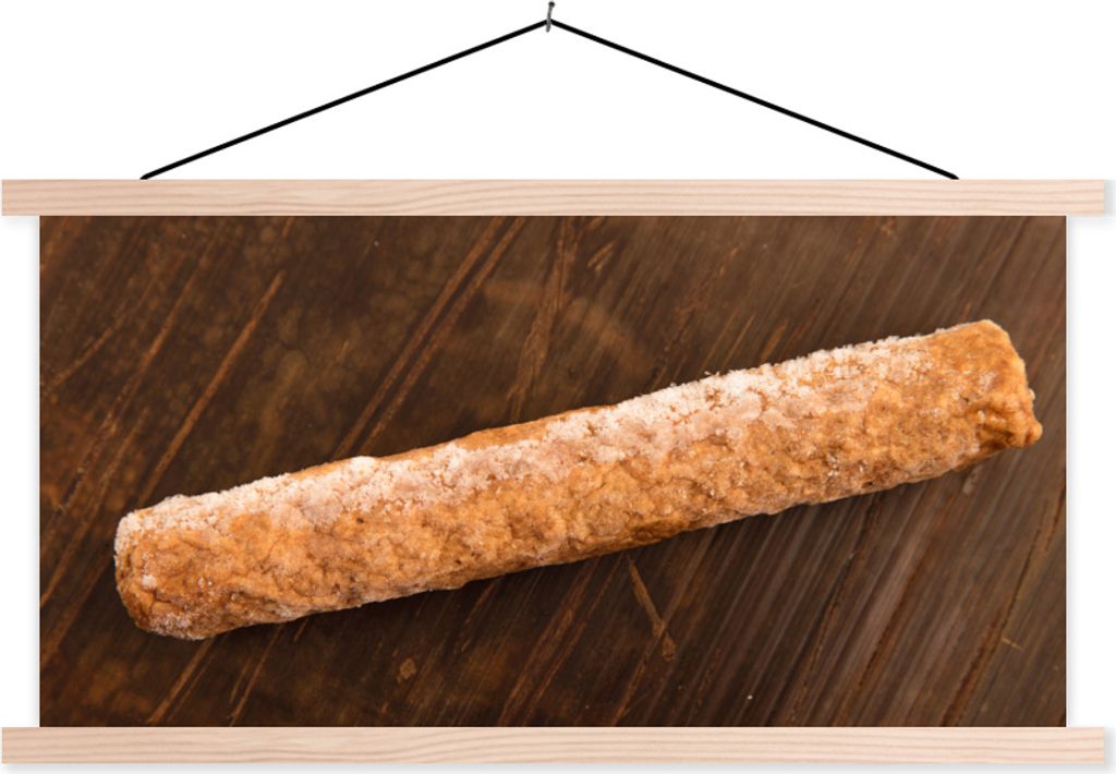 MuchoWow Textilposter Ein gefrorener Frikandel auf einem Holztisch 120x60 cm mit holzfarbenen Rahmen - Klemmleiste