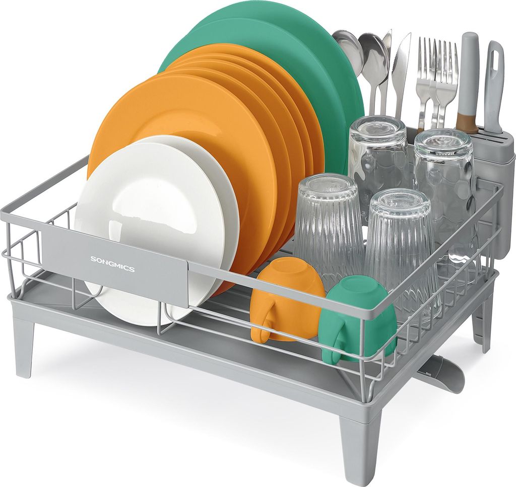 A dish rack filled with plates, cups, and cutlery.