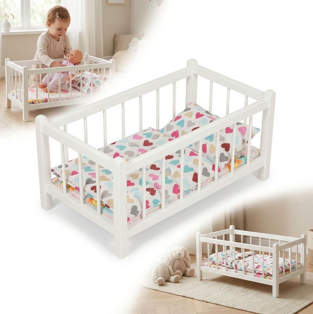 Ein weißes Puppenbett aus Holz mit Bettwäsche mit einem Produktbild 