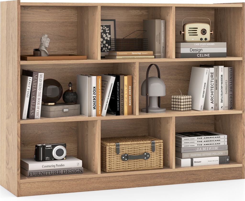 A wooden bookshelf filled with books and decorative items.