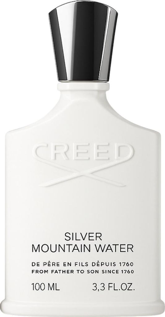A white perfume bottle with a silver cap.