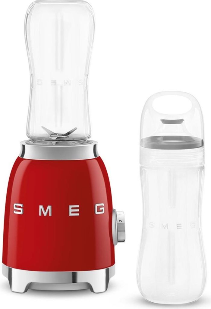 A red SMEG mini-stand mixer with a clear blending cup and a separate clear travel cup. The mixer has silver accents and the SMEG logo is visible.