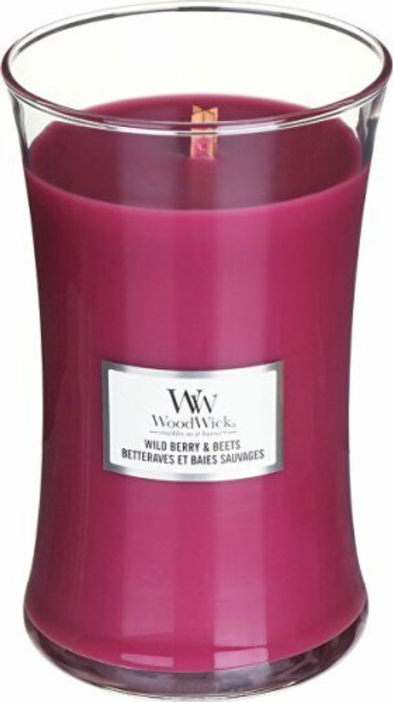 A WoodWick Wild Berry & Beets scented candle in a glass jar.
