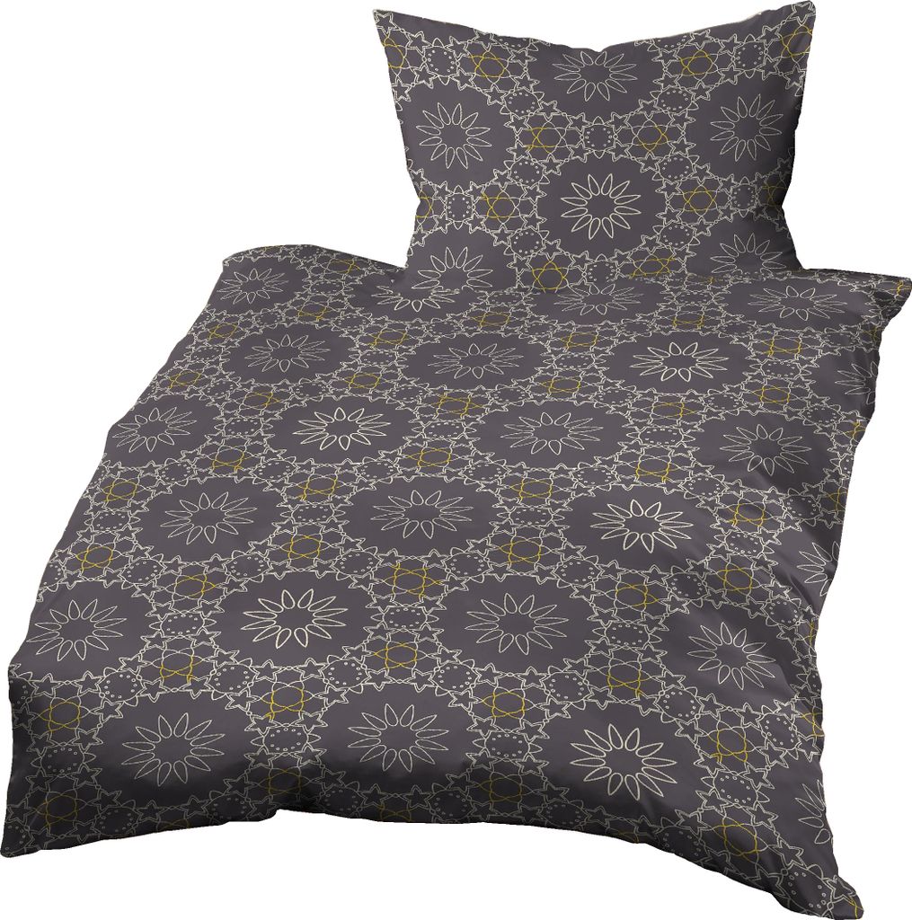 A duvet cover and pillow with a geometric pattern.