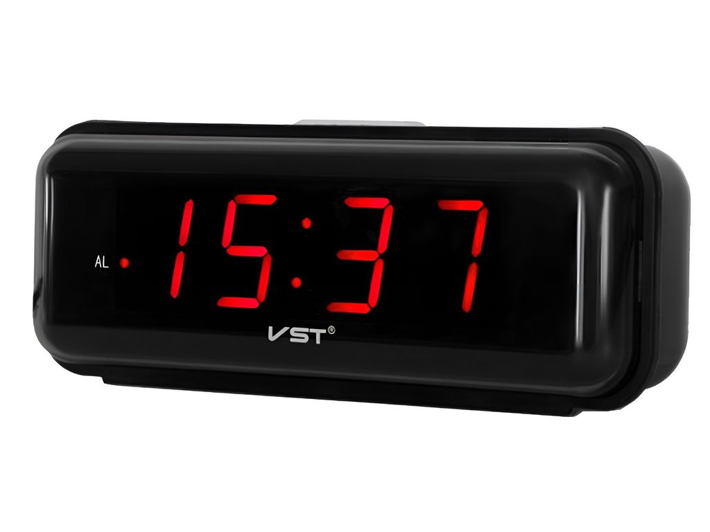 A black digital alarm clock with a red LED display showing the time.