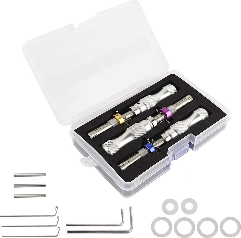A set of lock picking tools in a clear plastic case, with additional small metal rods and rings laid out below.
