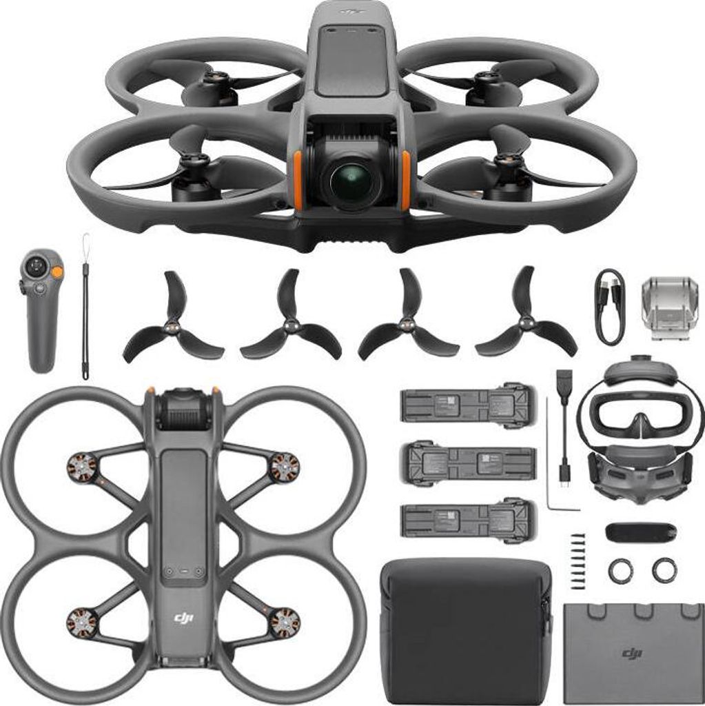 A flat lay of a drone and its accessories, including a controller, goggles, batteries, and propellers.