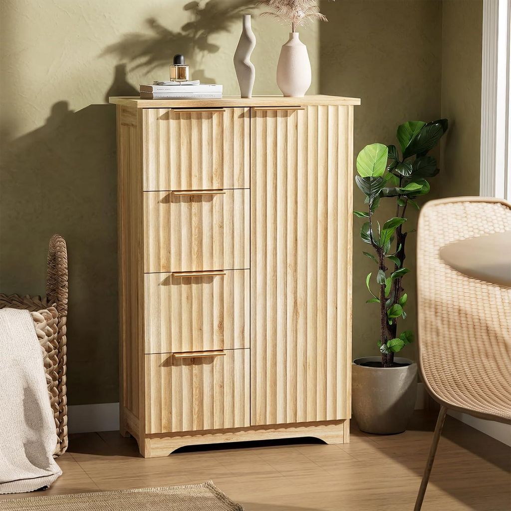 A wooden cabinet with drawers and doors is shown in a room setting, next to a plant and a chair.