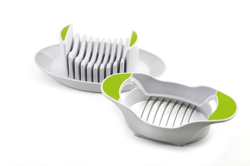 A white and green egg slicer and tomato slicer set on a white background.