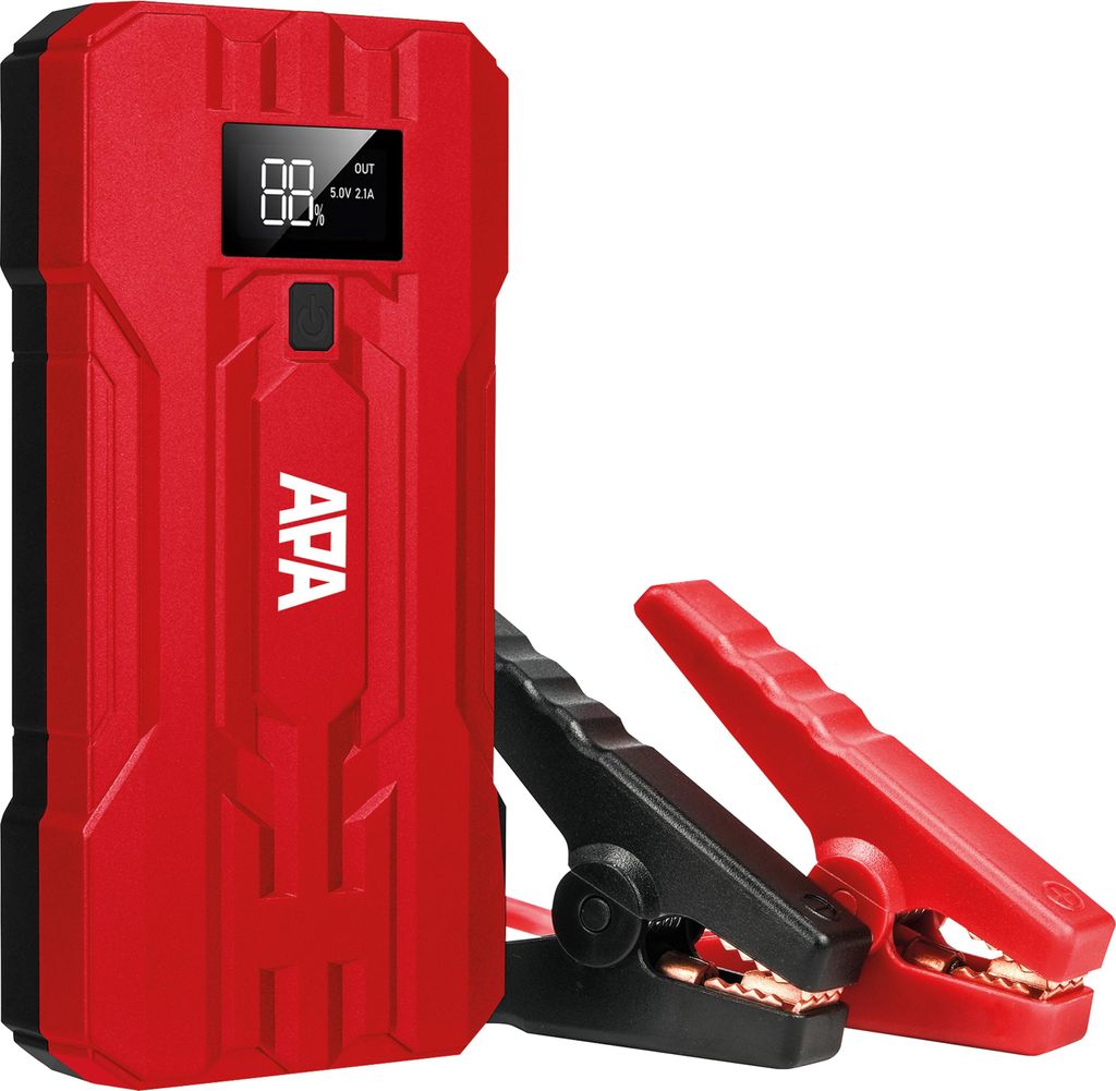 A red and black portable jump starter with jumper cables attached.