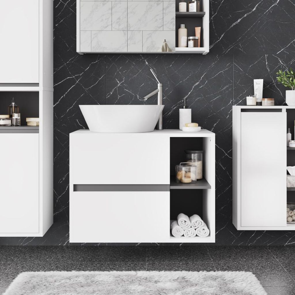 A modern bathroom vanity with a vessel sink and marble-patterned walls.