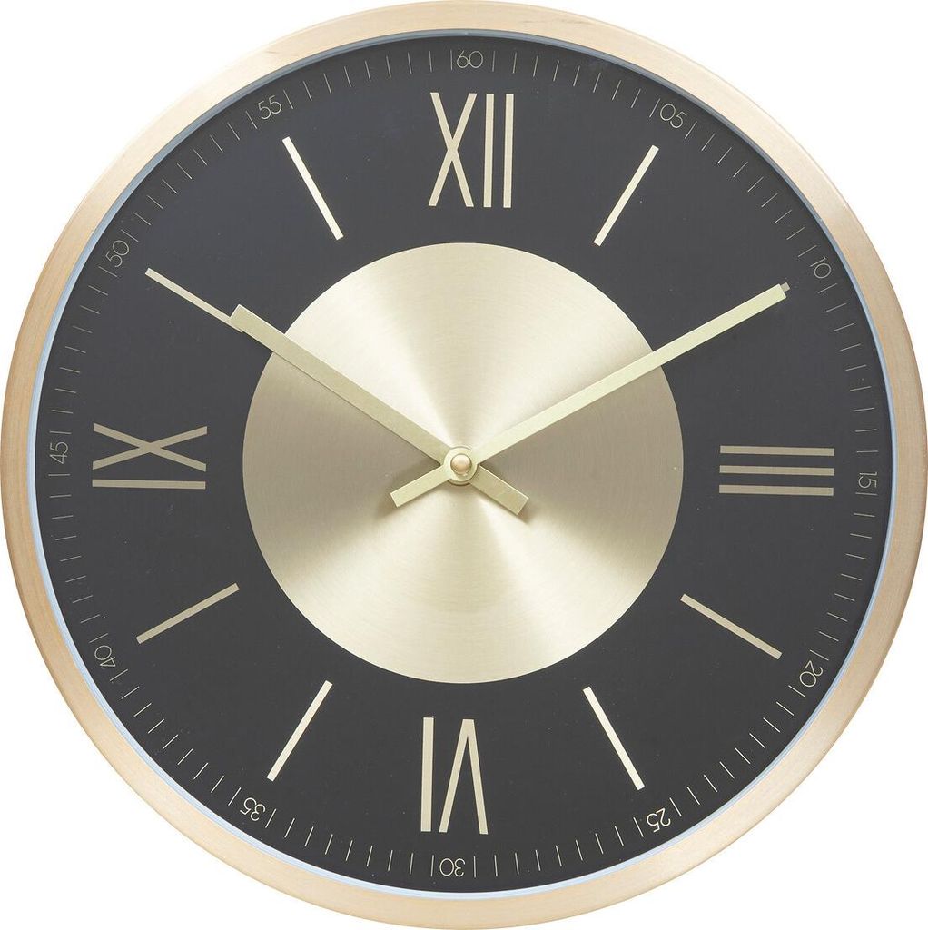 A close-up view of a modern wall clock with a black face and gold accents.