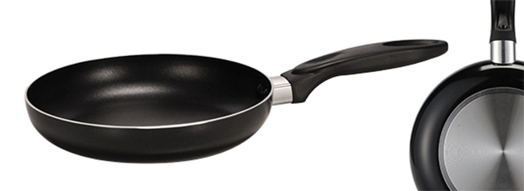 A black frying pan with a silver bottom is shown against a white background.