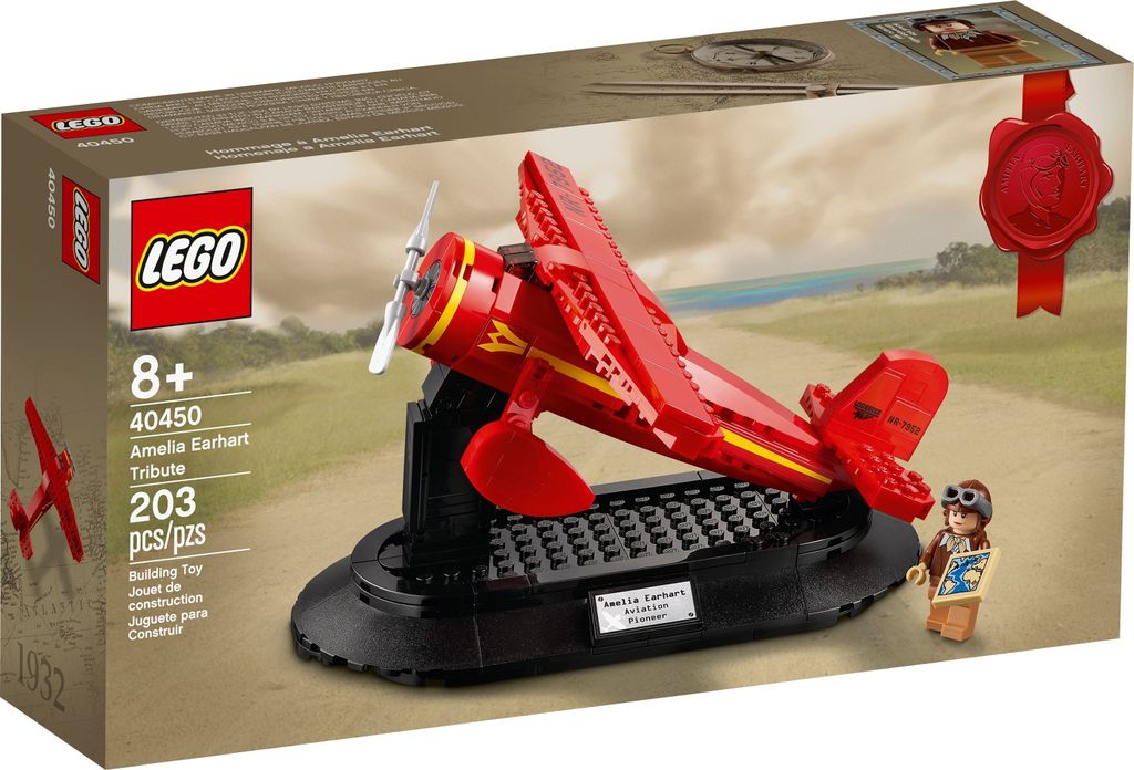 The image shows the LEGO set packaging for the Amelia Earhart Tribute, featuring a red airplane model on a display stand and a minifigure.