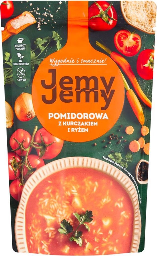 A pouch of tomato soup with chicken and rice, surrounded by fresh ingredients like tomatoes, onions, and carrots.