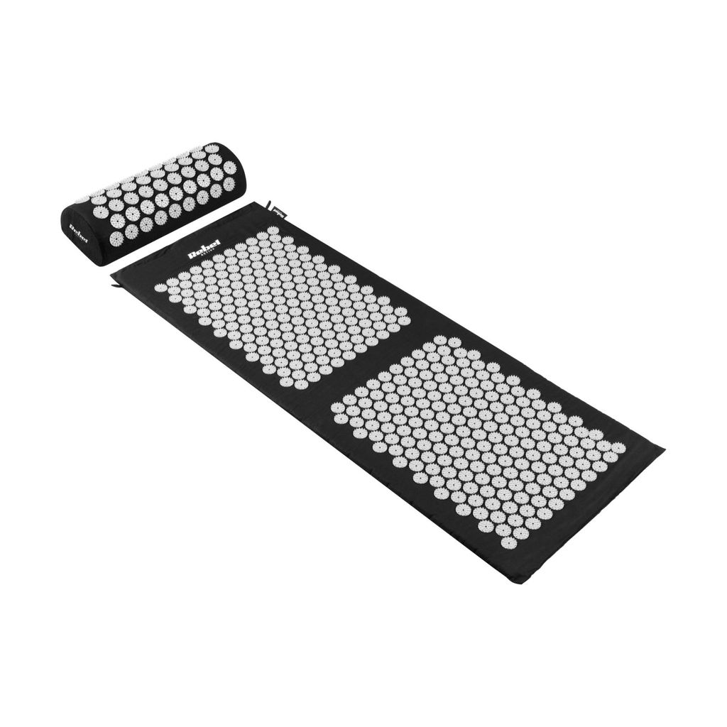 A black acupressure mat and pillow with white spikes are displayed on a white background.