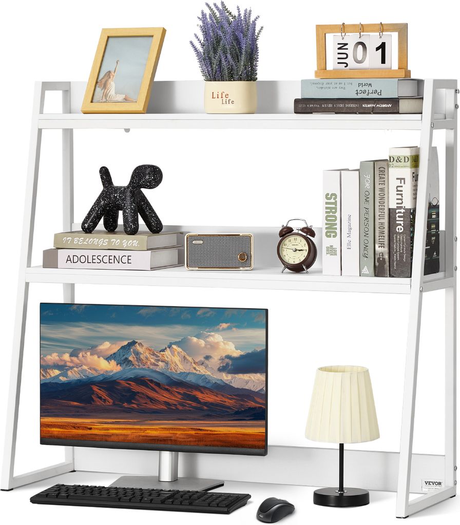 A white bookshelf organizer with various items on its shelves, including books, a picture frame, a plant, a clock, a radio, a computer monitor, a keyboard, a mouse, and a lamp.