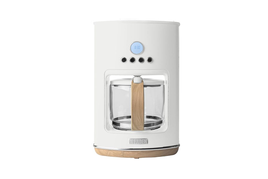 A white coffee maker with wood accents is shown against a white background.