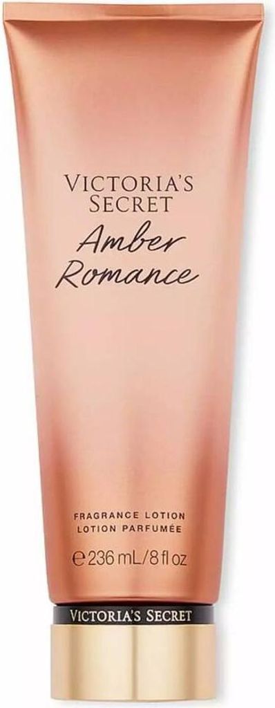 A close-up studio shot of a Victoria's Secret Amber Romance body lotion bottle against a white background.