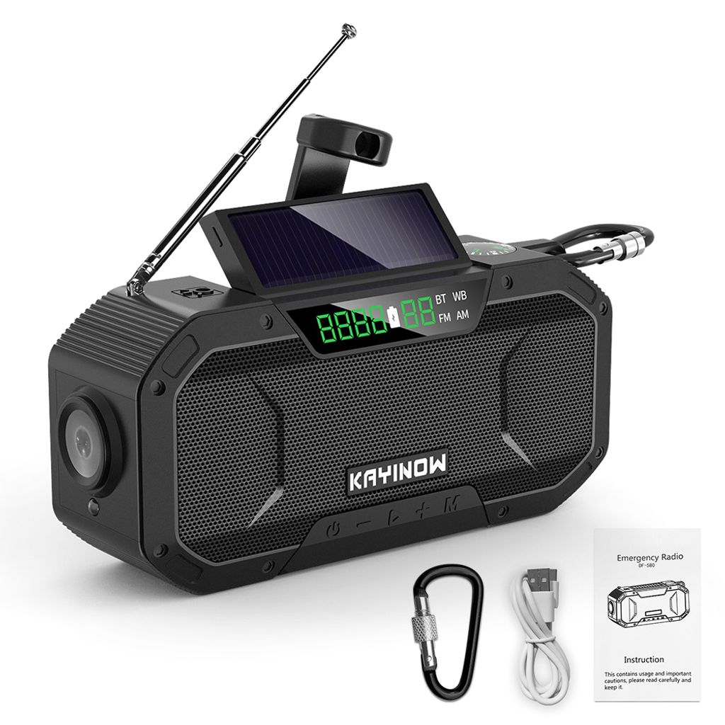 A black emergency radio with a solar panel, antenna, and display screen, shown with accessories.