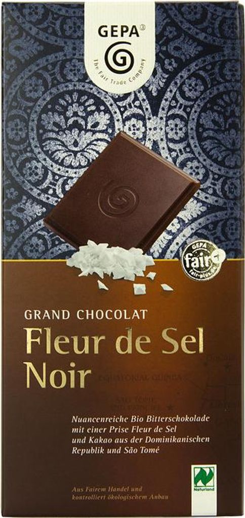 A product package for chocolate with a piece of chocolate and salt flakes shown.