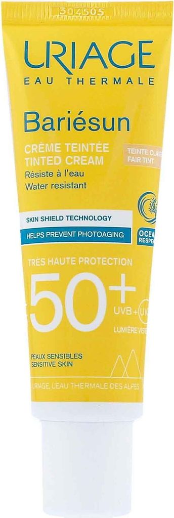 A close-up of a yellow tube of Uriage Bariésun tinted cream with SPF 50+.
