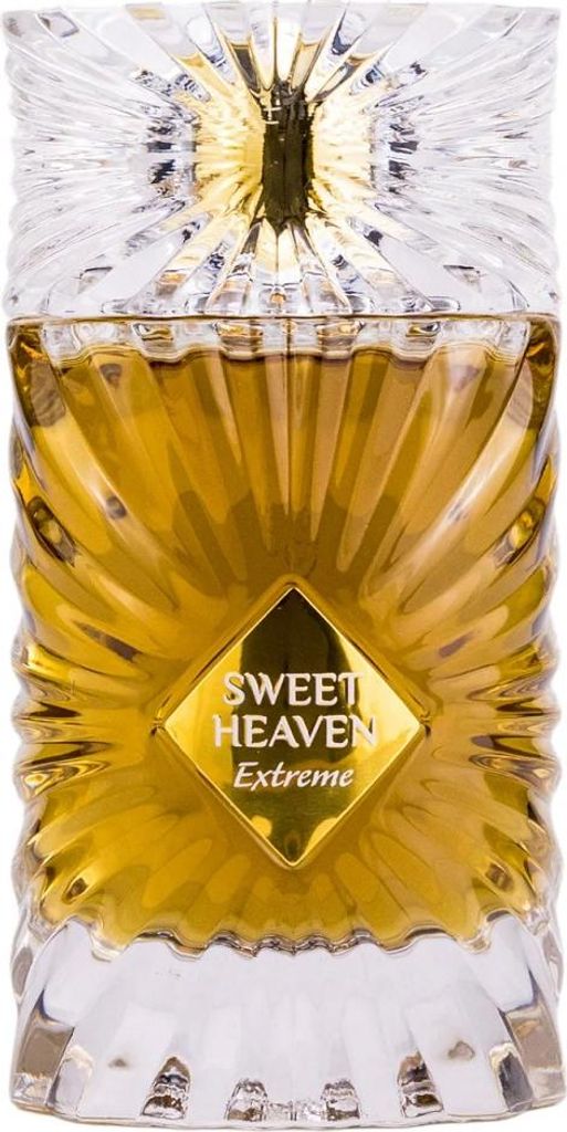 A perfume bottle with a golden liquid and a clear, faceted cap and base.
