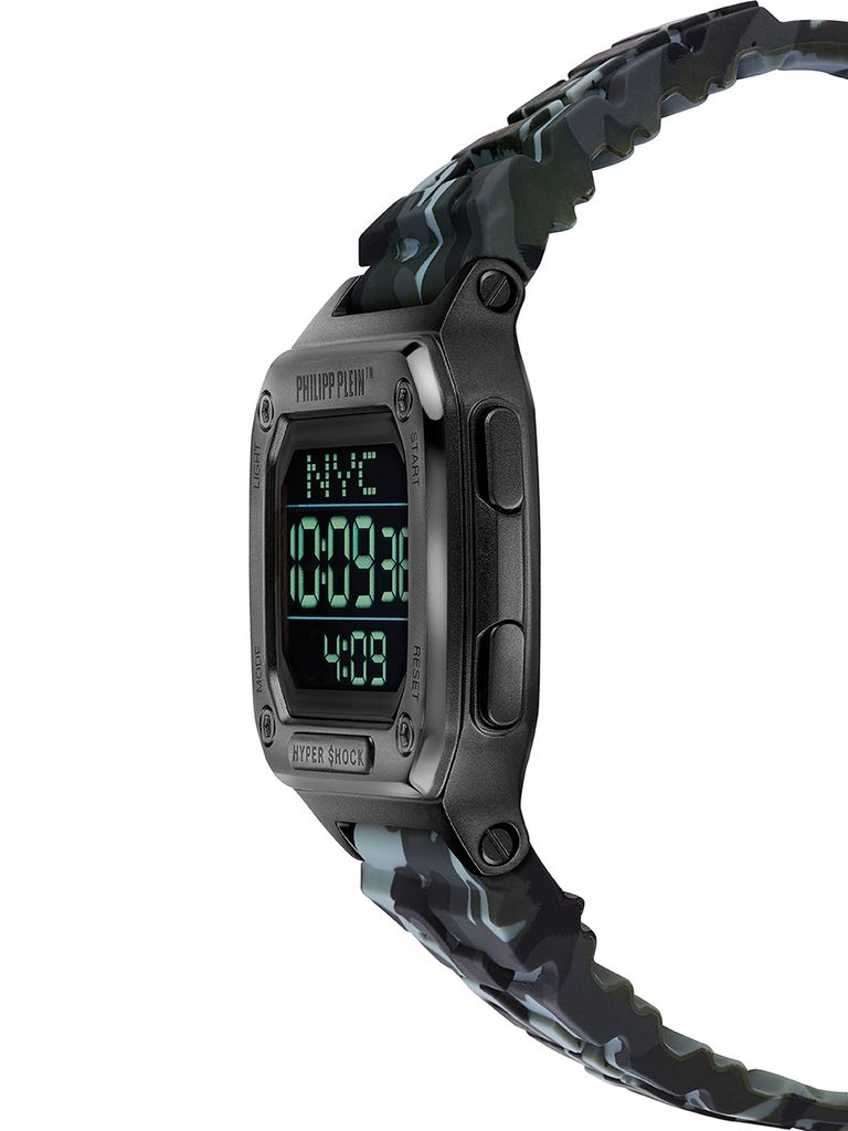 A close-up side view of a digital watch with a camouflage strap.