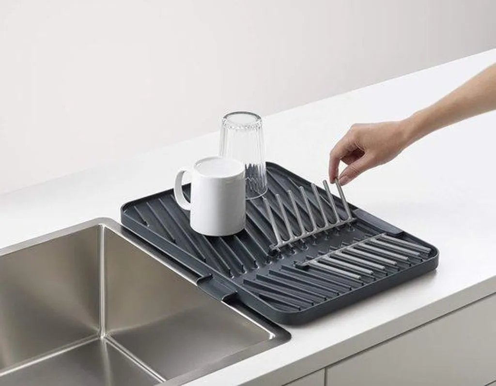 Solution anti-obstruction : Grille d'évacuation grise à bac pliable