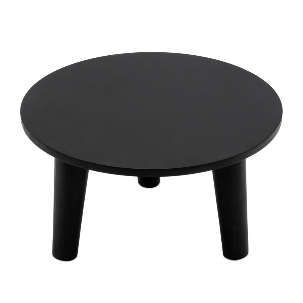 A black round plant stand with three legs on a white background.