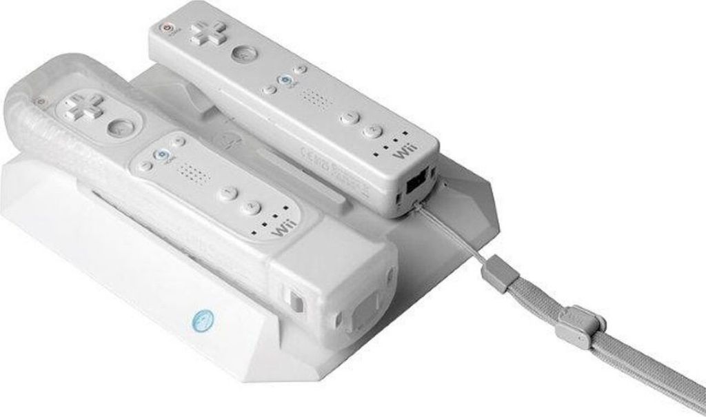 A white charging dock with two white Nintendo Wii controllers and a wrist strap.