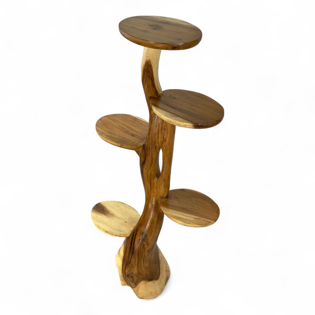 A wooden plant stand with multiple shelves, shaped like a tree.