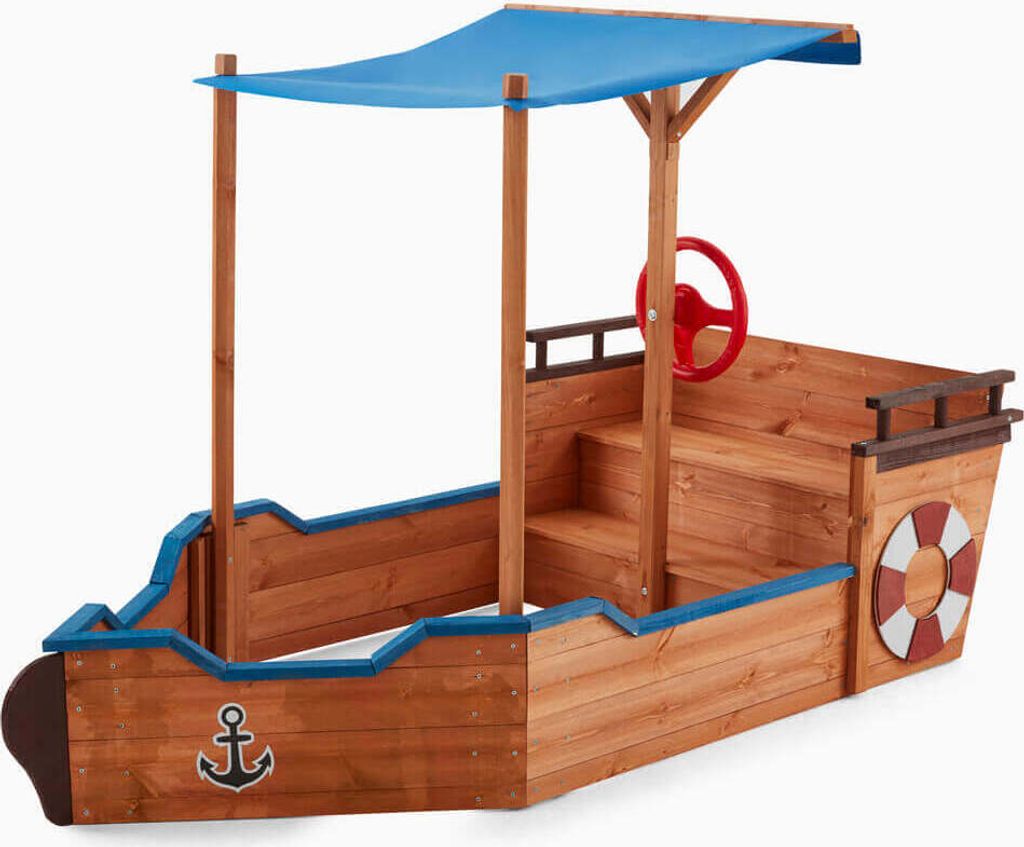 A wooden sandbox designed to look like a pirate ship, with a blue canopy and a red steering wheel.