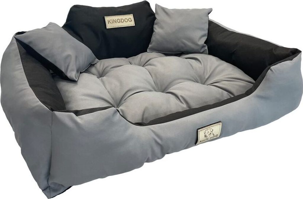 A dog bed with pillows on a white background.