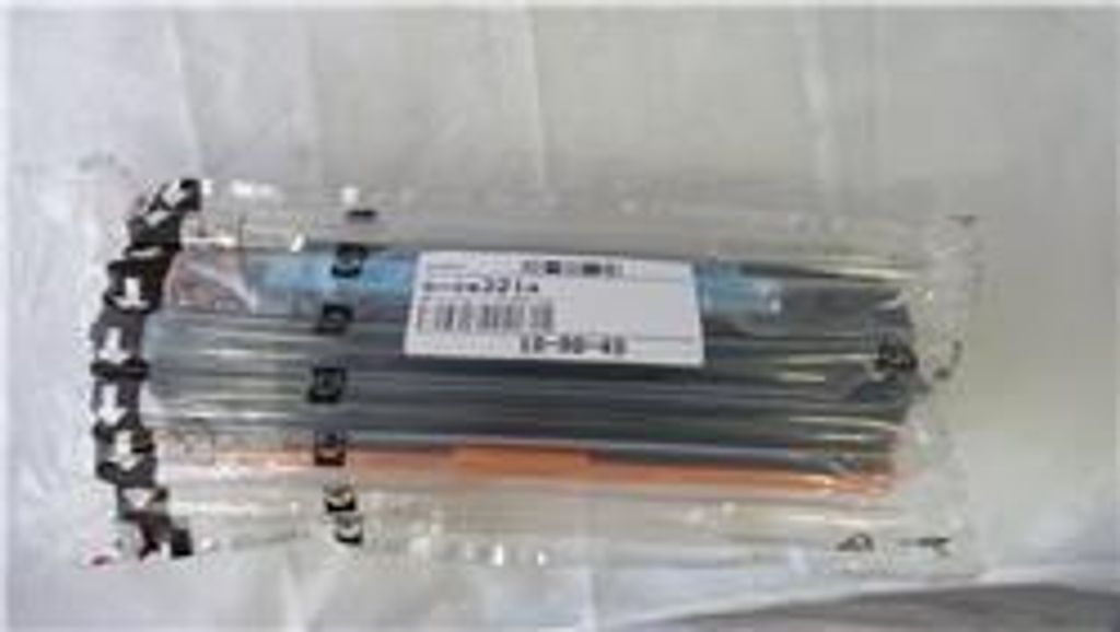 A sealed plastic package containing multiple toner cartridges.