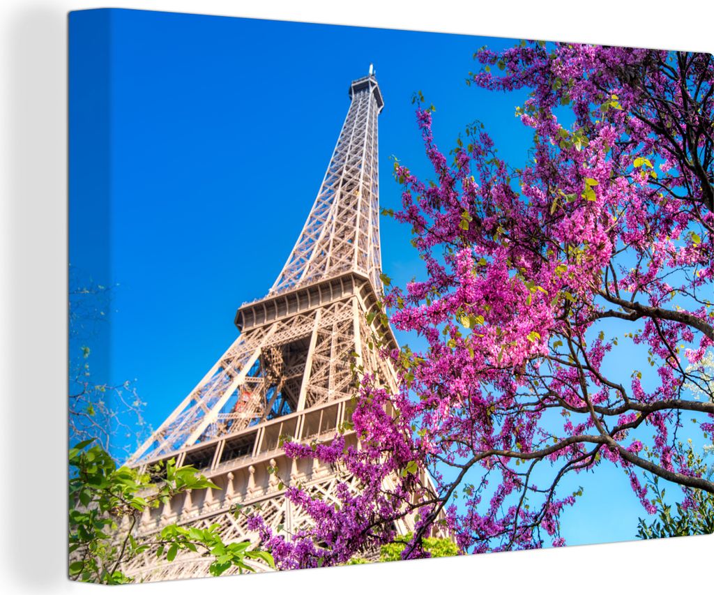 OneMillionCanvasses - Leinwandbilder - 140x90 cm, Der Eiffelturm mit einem einzigartigen rosafarbenen Baum, der dem Bild einen farbenfrohen Effek...