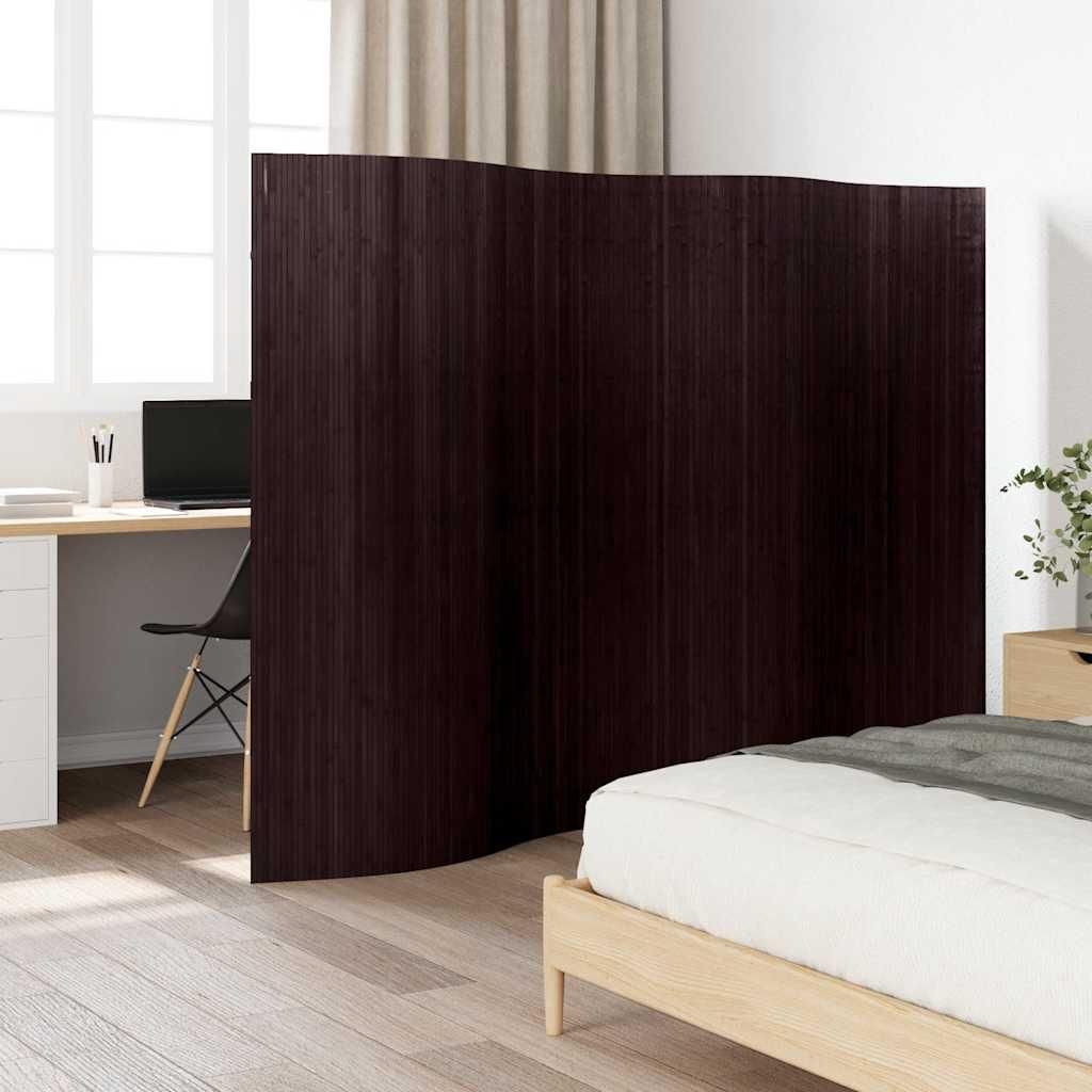 A room divider is placed between a desk area and a bed, suggesting a bedroom or studio apartment setting.
