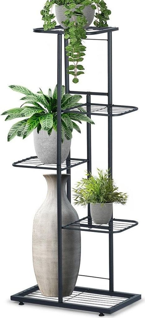 A multi-tiered metal plant stand holding several potted plants and a decorative vase.