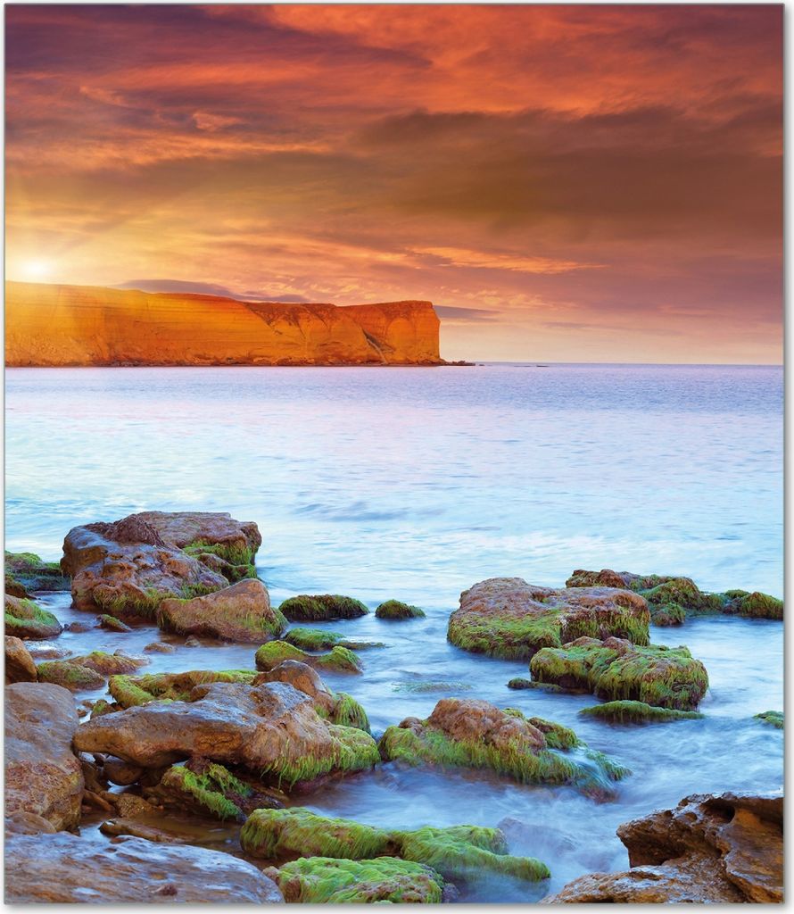 Wallario Herdabdeckplatte aus Glas, Größe 52 x 60 cm 1-teilig, Motiv Sonnenaufgang am Meer mit Landzunge und Felsen im Wasser