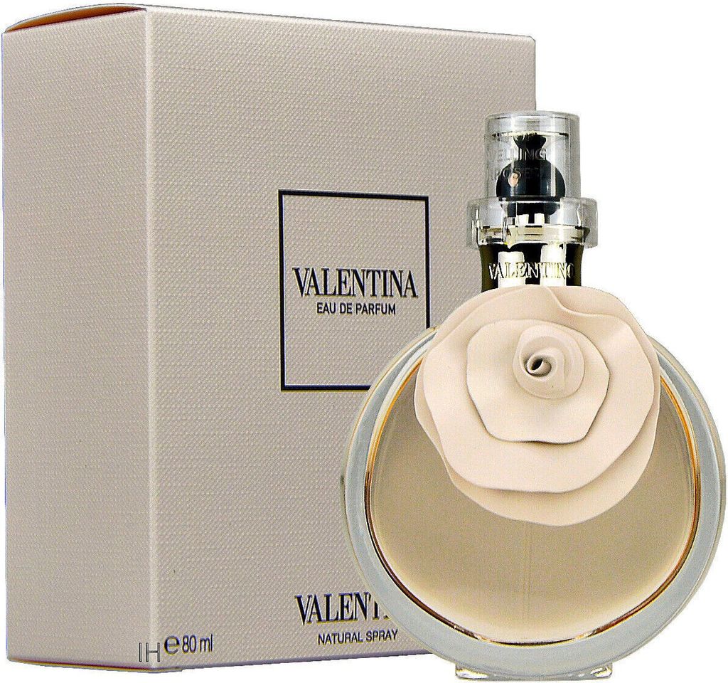 A perfume bottle and its box are displayed.