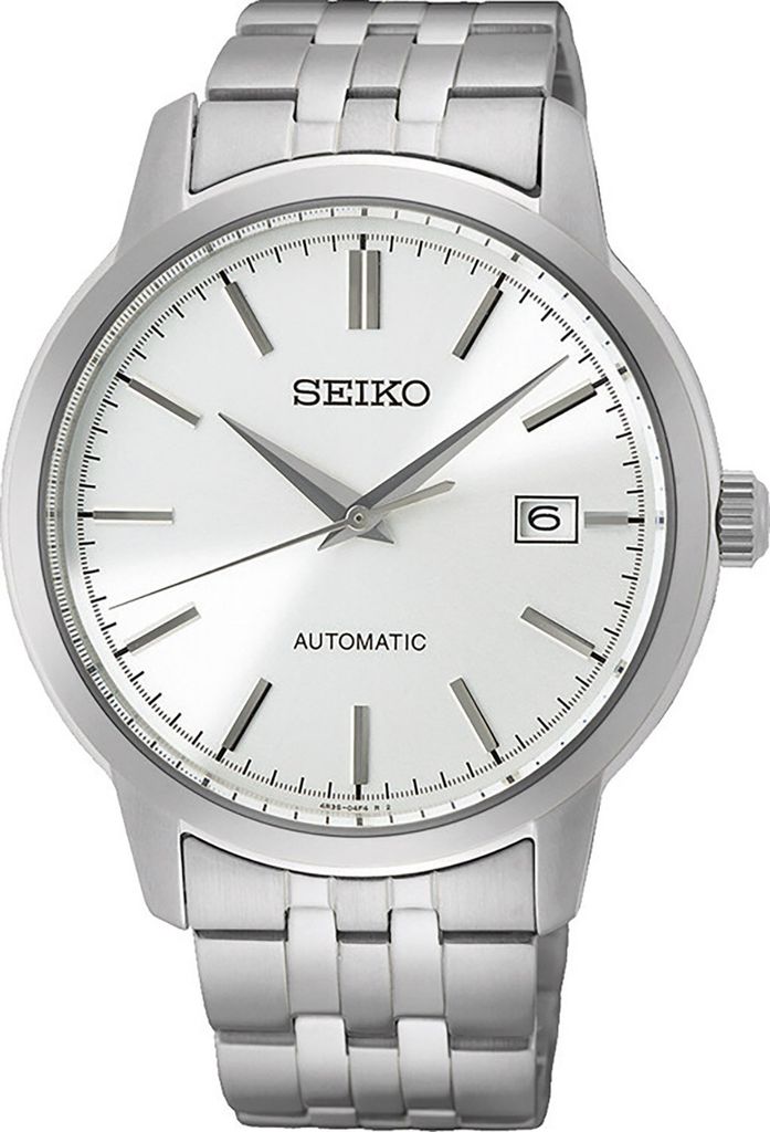 A close-up studio shot of a silver Seiko automatic watch with a white dial.