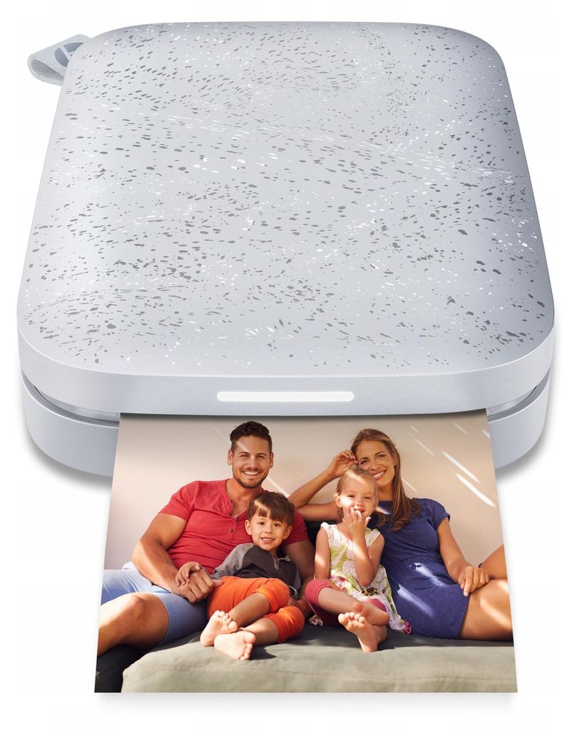 A family is printed on a photo coming out of a white pocket printer.