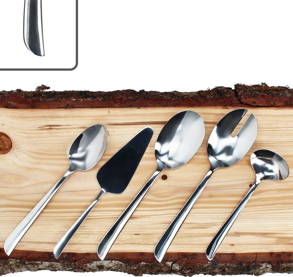 A set of five stainless steel cutlery pieces arranged on a wooden surface with bark.