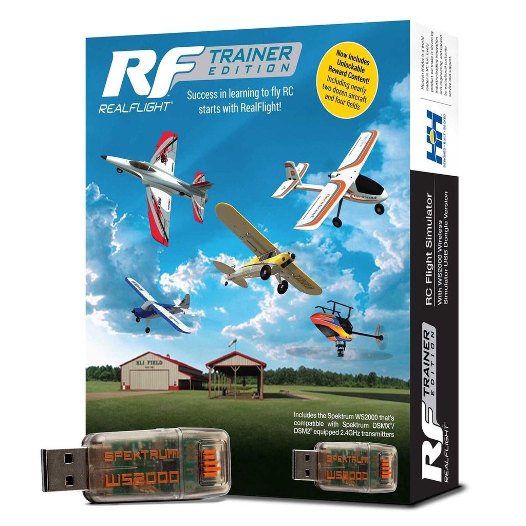The image shows the box of a RealFlight Trainer Edition RC Flight Simulator, with various RC aircraft depicted in flight against a blue sky with clouds. Two USB dongles are also shown in the foreground.