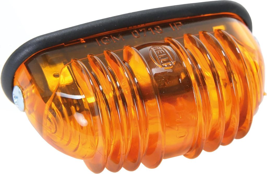 A close-up studio shot of an orange automotive blinker light.