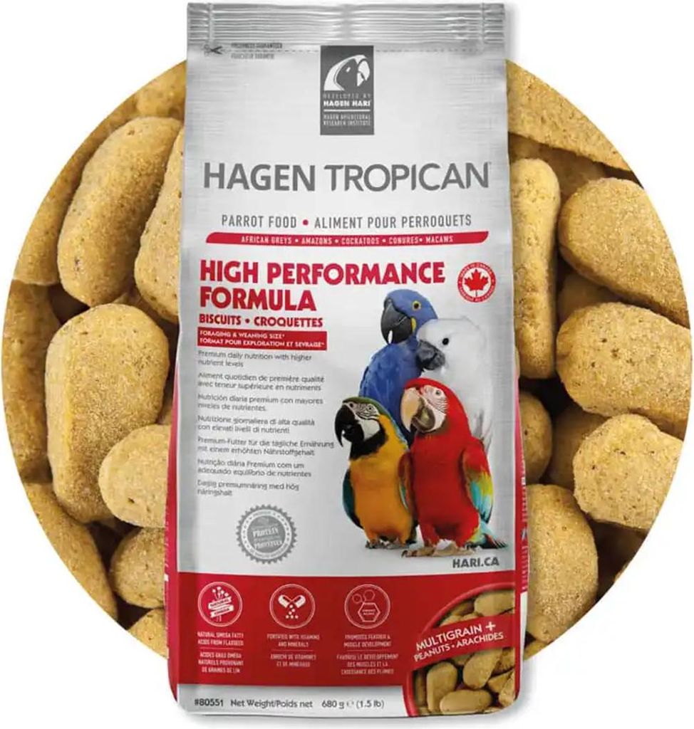 A bag of Hagen Tropican parrot food surrounded by the food pellets.